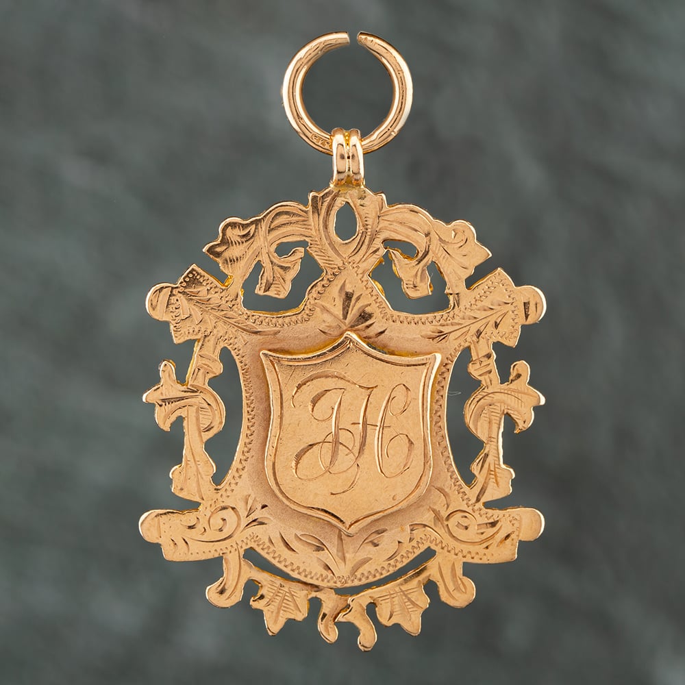 Product photograph of Pre-owned Vintage 9ct Rose Gold Shield Shape Medallion 41141499 from The Jewel Hut