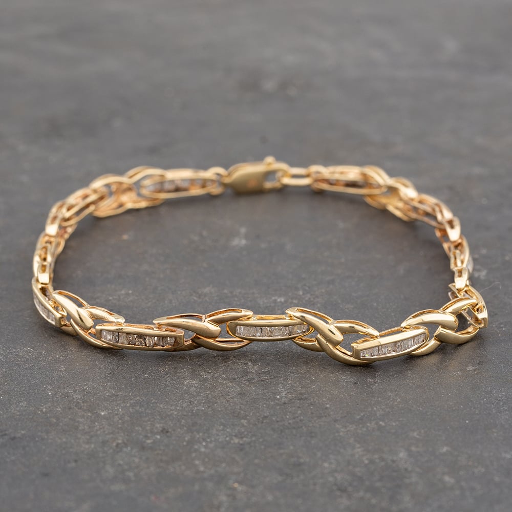 Product photograph of Pre-owned 9ct Yellow Gold Baguette Cut Diamond 7 5 Inch Bracelet 41281358 from The Jewel Hut