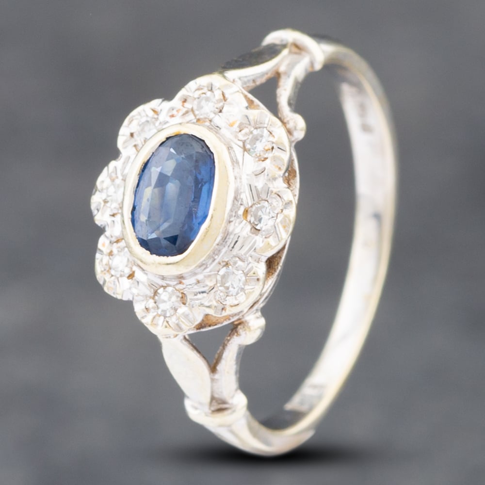 Product photograph of Pre-owned 9ct White Gold Sapphire Amp Single Cut Diamond Oval Cluster Ring 41382336 from The Jewel Hut