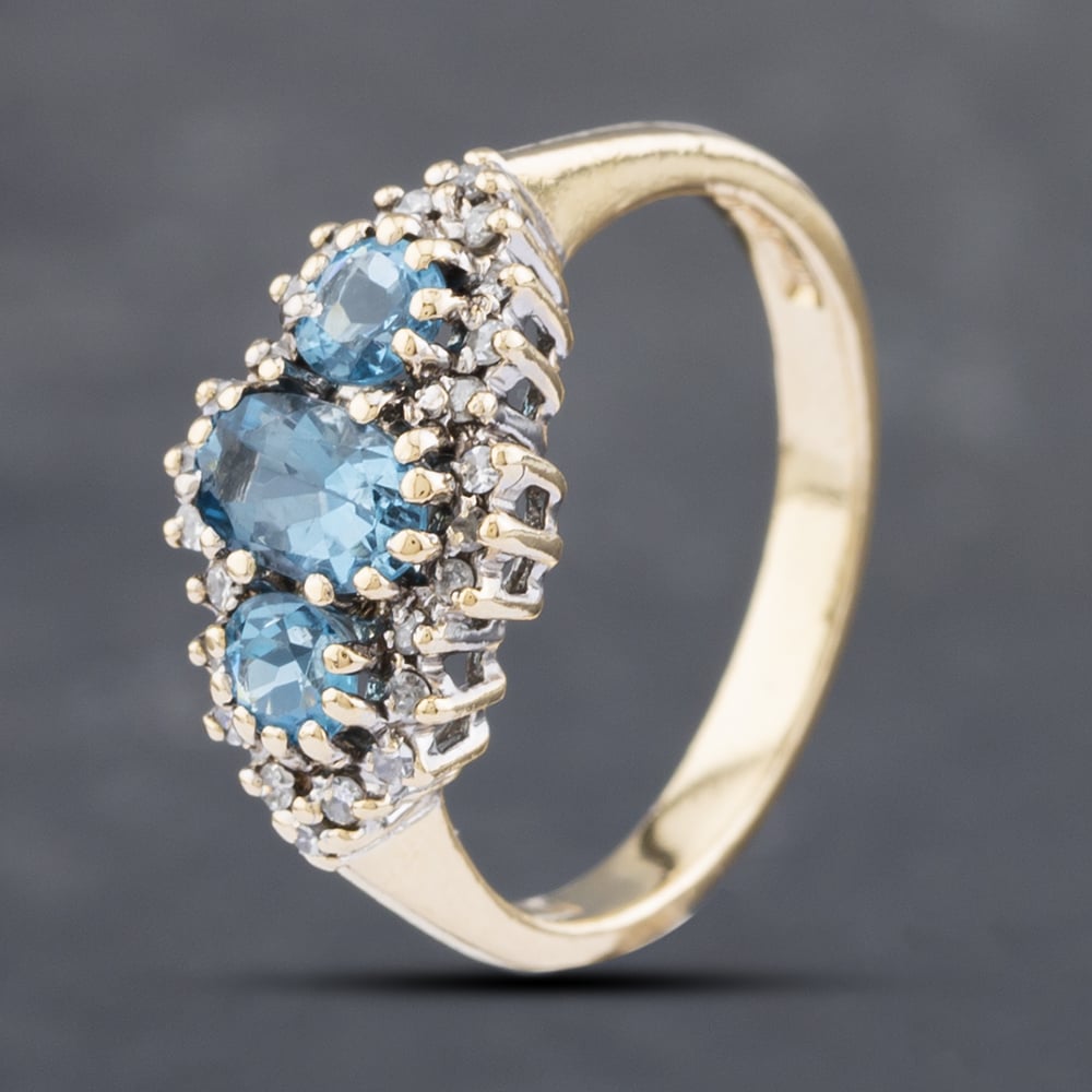 Product photograph of Pre-owned 9ct Yellow Gold Blue Topaz Amp Diamond Cluster Ring 41382472 from The Jewel Hut