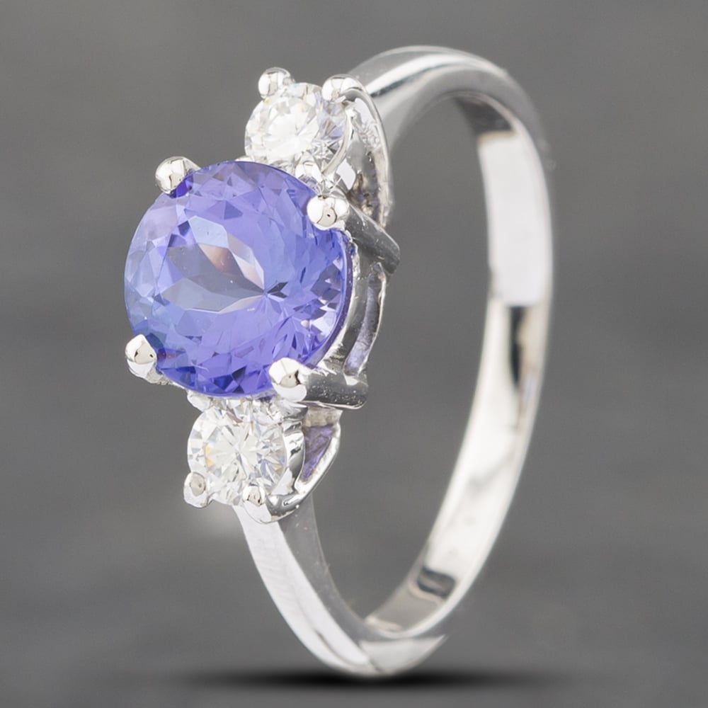 Product photograph of Pre-owned 14ct White Gold Tanzanite Amp 0 25ct Brilliant Cut Diamond Three Stone Ring 43411026 from The Jewel Hut