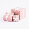 Pink wrapping with a white bow