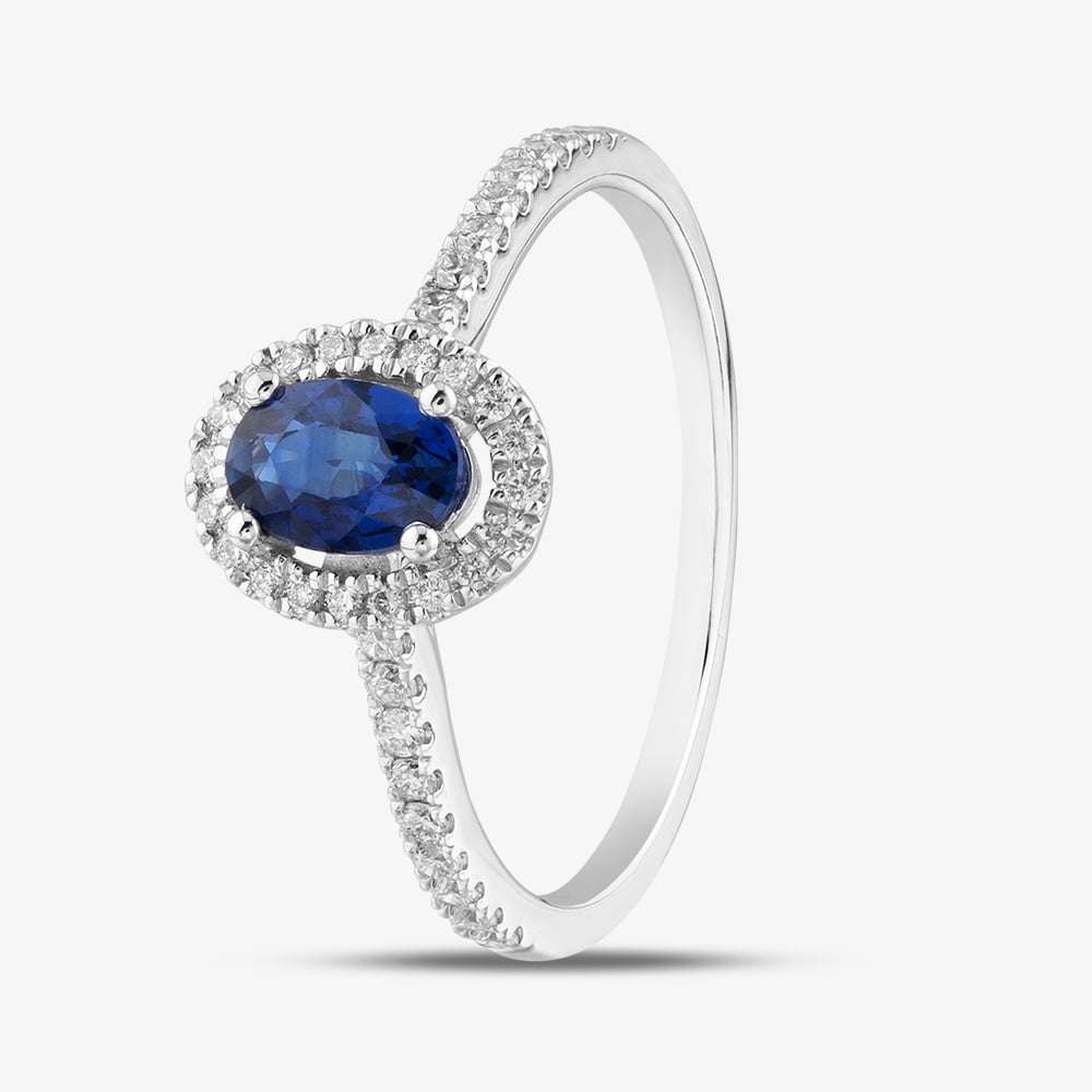 Product photograph of 18ct White Gold Oval Cut Sapphire Amp Brilliant Cut Diamond Shoulder Set Halo Ring R57704-sap M from The Jewel Hut