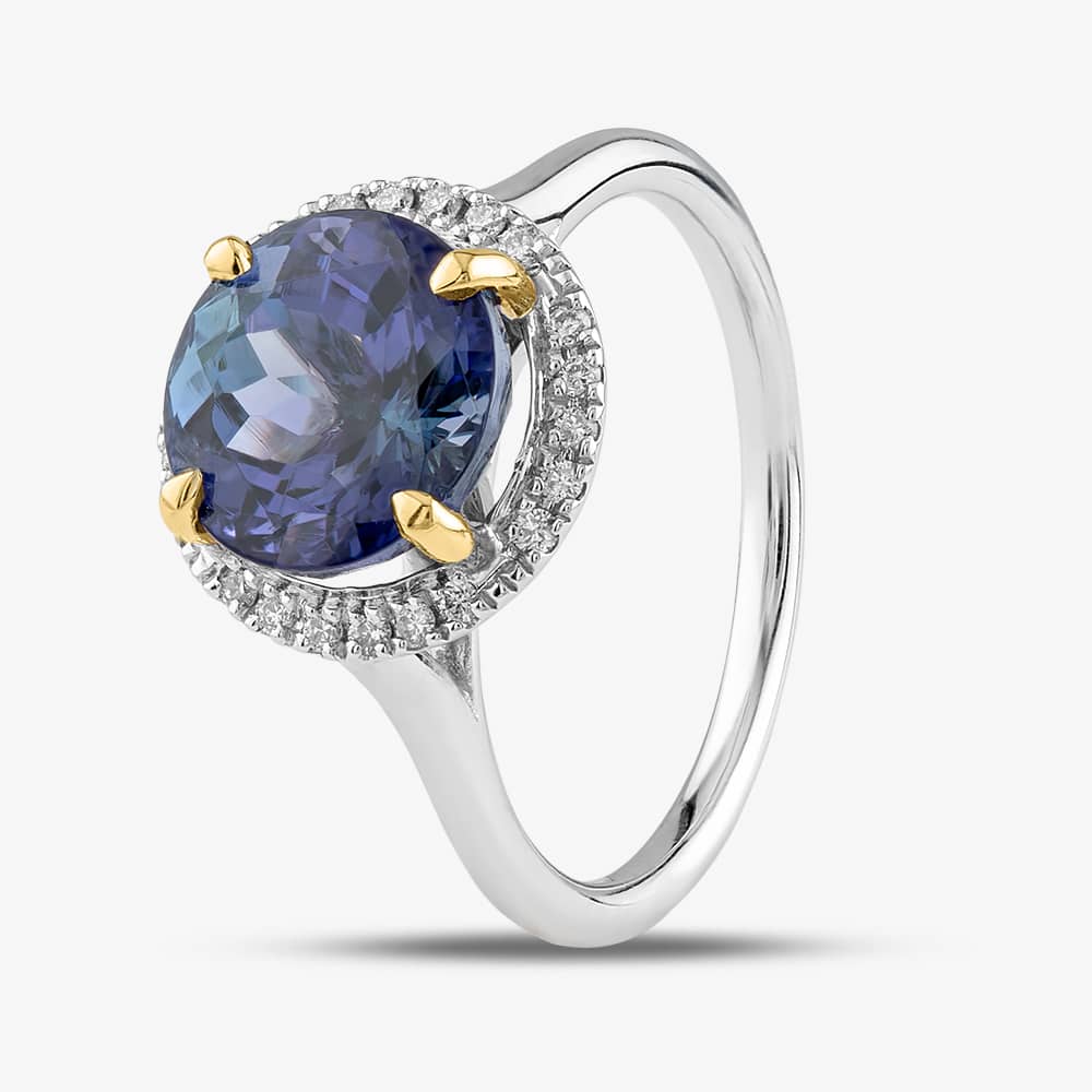Product photograph of 18ct White Gold 3 51ct Brilliant Cut Tanzanite Amp 0 12ct Diamond Halo Ring Ntr2027gtzd-18ywg from The Jewel Hut