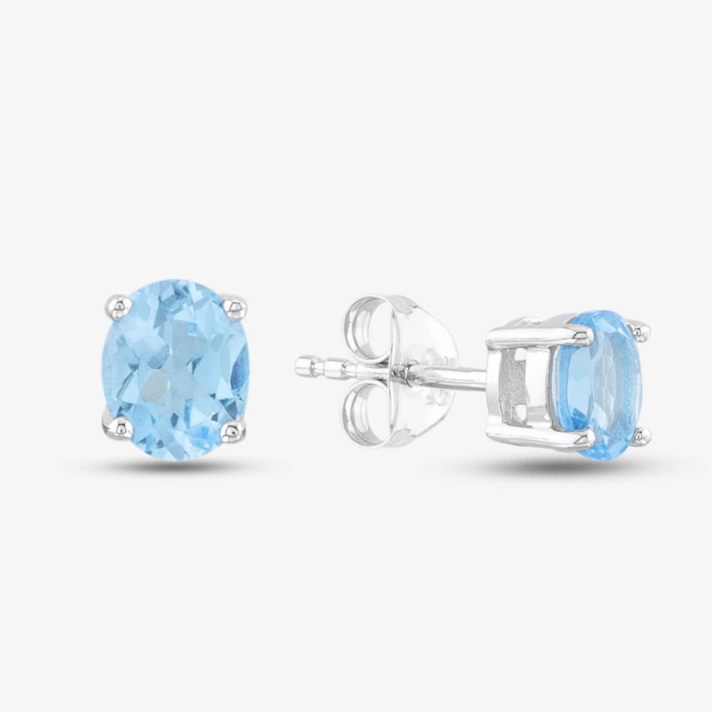 Product photograph of 9ct White Gold Oval Cut Blue Topaz Stud Earrings Ojs0006e-sbt 9kw from The Jewel Hut