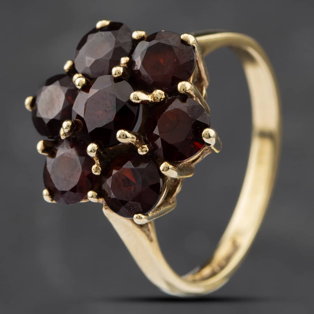 Product photograph of Pre-owned 9ct Yellow Gold Garnet Seven Stone Cluster Ring 41102022 from The Jewel Hut