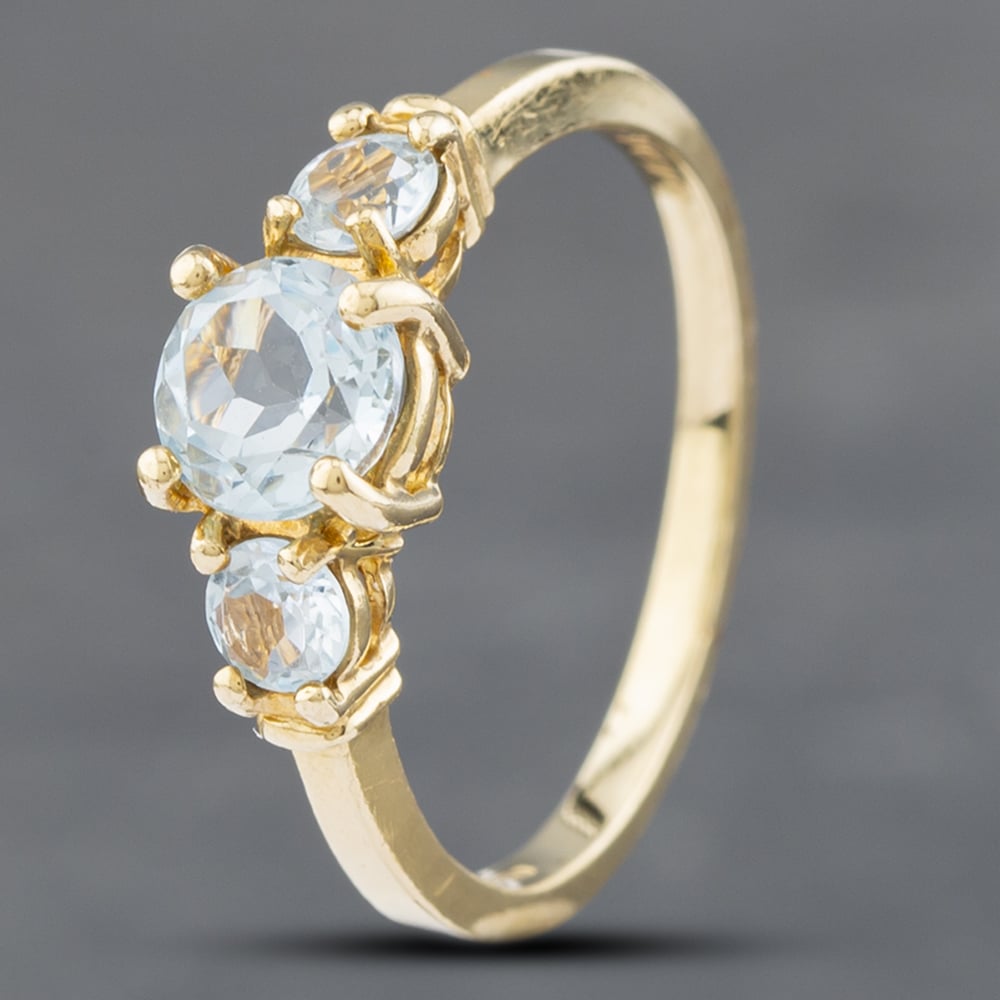 Product photograph of Pre-owned 9ct Yellow Gold Blue Topaz Three Stone Ring 41102445 from The Jewel Hut