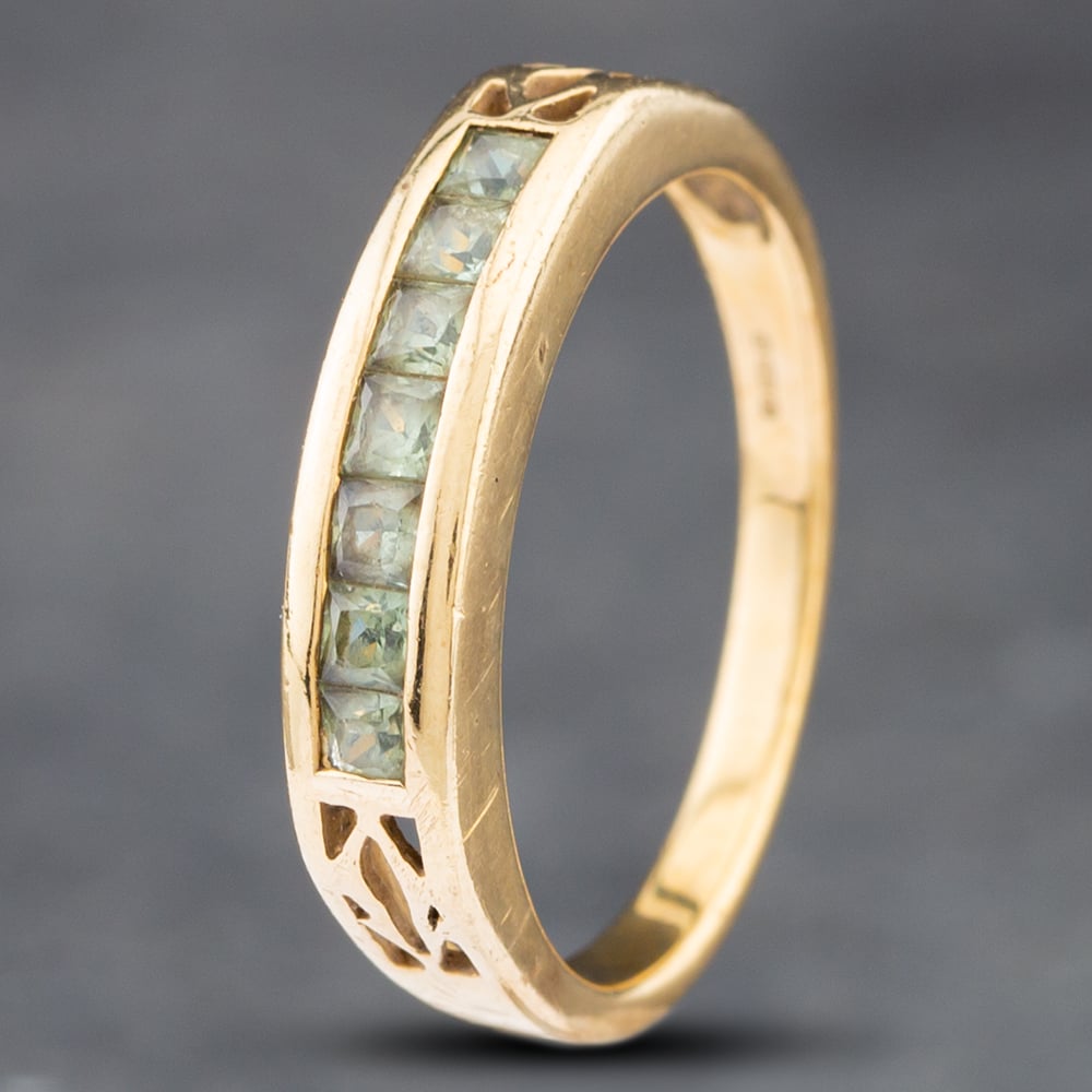 Product photograph of Pre-owned 9ct Yellow Gold Sapphire Channel Set Half Eternity Ring 41102461 from The Jewel Hut