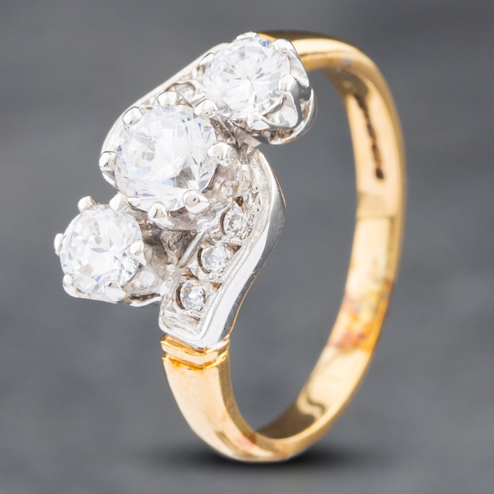 Product photograph of Pre-owned 9ct Yellow Gold Cubic Zirconia Twist Three Stone Ring 41102464 from The Jewel Hut