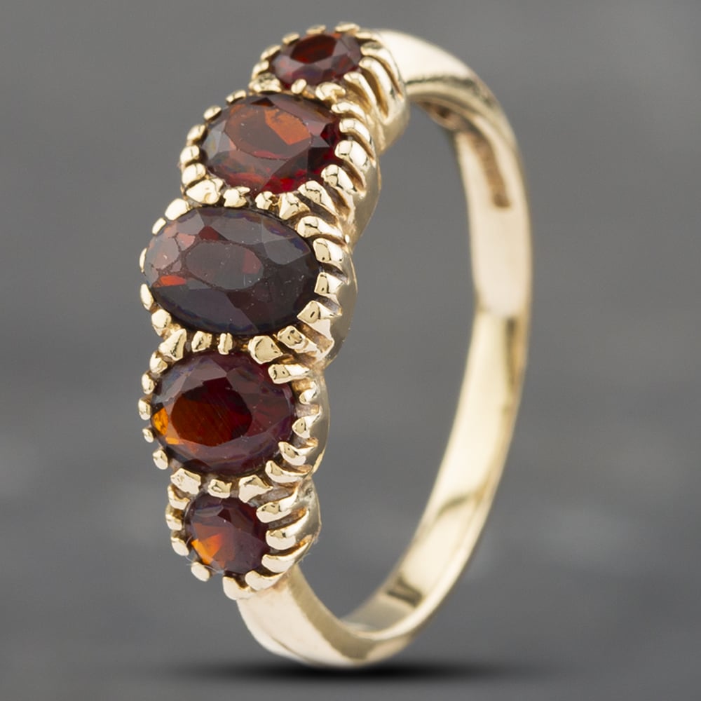 Product photograph of Pre-owned 9ct Yellow Gold Garnet Five Stone Ring 41102504 from The Jewel Hut