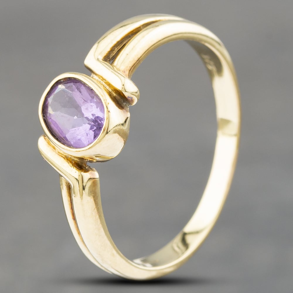 Product photograph of Pre-owned 9ct Yellow Gold Amethyst Oval Twist Dress Ring 41102517 from The Jewel Hut