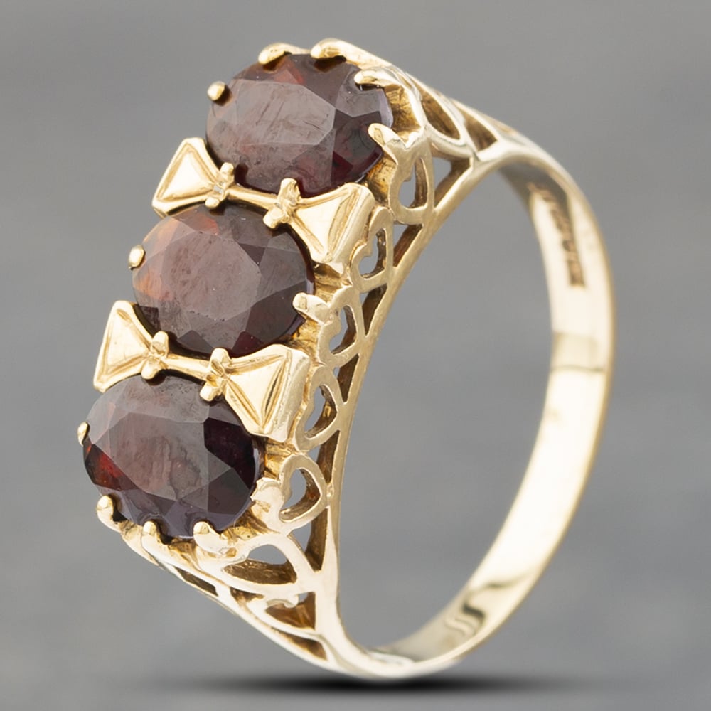 Product photograph of Pre-owned 9ct Yellow Gold Garnet Three Stone Ring 41102518 from The Jewel Hut