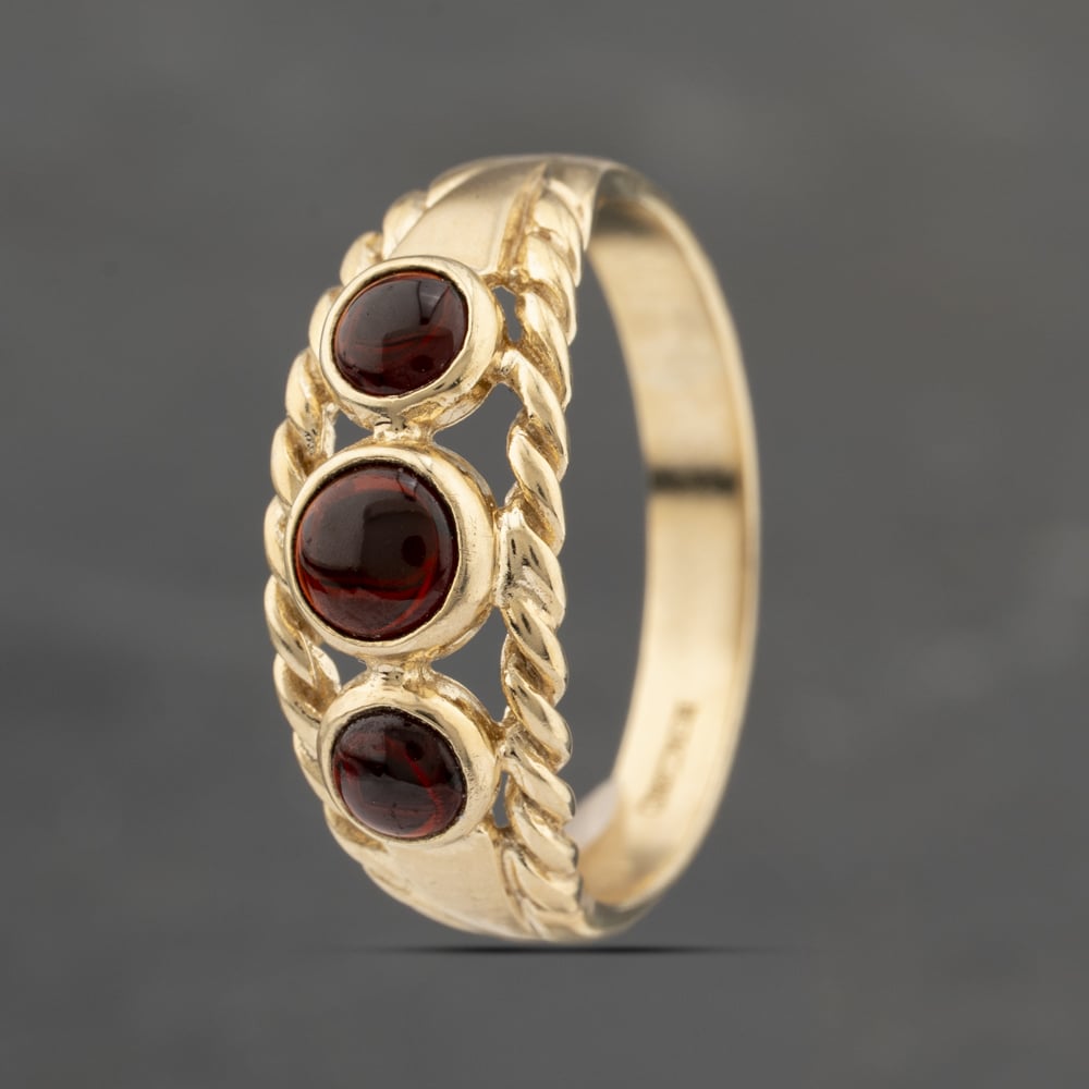 Click to view product details and reviews for Pre Owned 9ct Yellow Gold Garnet Rubover Set Three Stone Ring 41103429. Click to view product details and reviews for Pre Owned 9ct Yellow Gold Garnet Rubover Set Three Stone Ring 41103429.