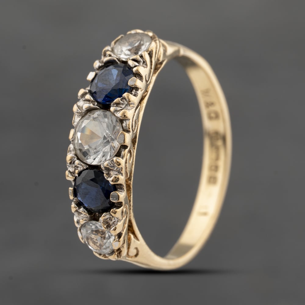 Click to view product details and reviews for Pre Owned 9ct Yellow Gold Spinel Blue And White Five Stone Ring 41103619.