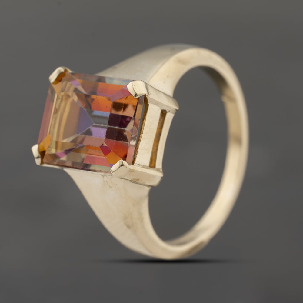 Click to view product details and reviews for Pre Owned 9ct Yellow Gold Mystic Topaz Oblong Dress Ring 41103725.