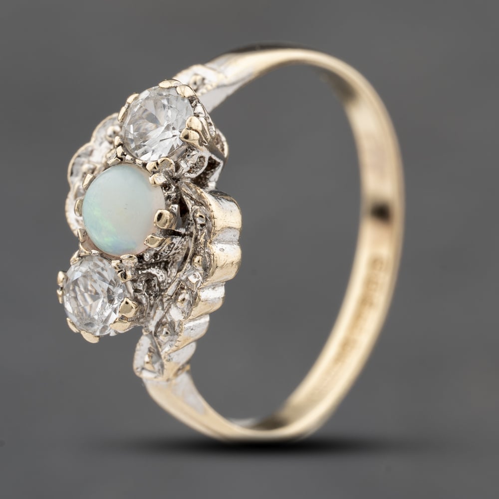Click to view product details and reviews for Pre Owned Vintage 9ct Yellow Gold Opal And White Spinel Twist Three Stone Ring 41103815.
