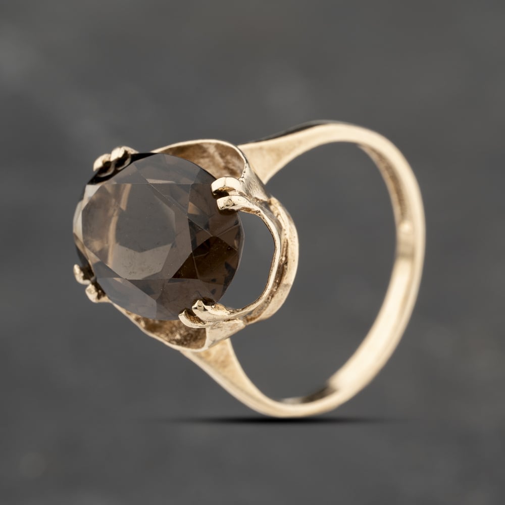 Click to view product details and reviews for Pre Owned 9ct Yellow Gold Smoky Quartz Large Oval Dress Ring 41103852.