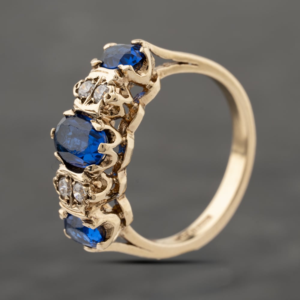 Click to view product details and reviews for Pre Owned 9ct Yellow Gold Blue Spinel And White Spinel Seven Stone Ring 41103932.