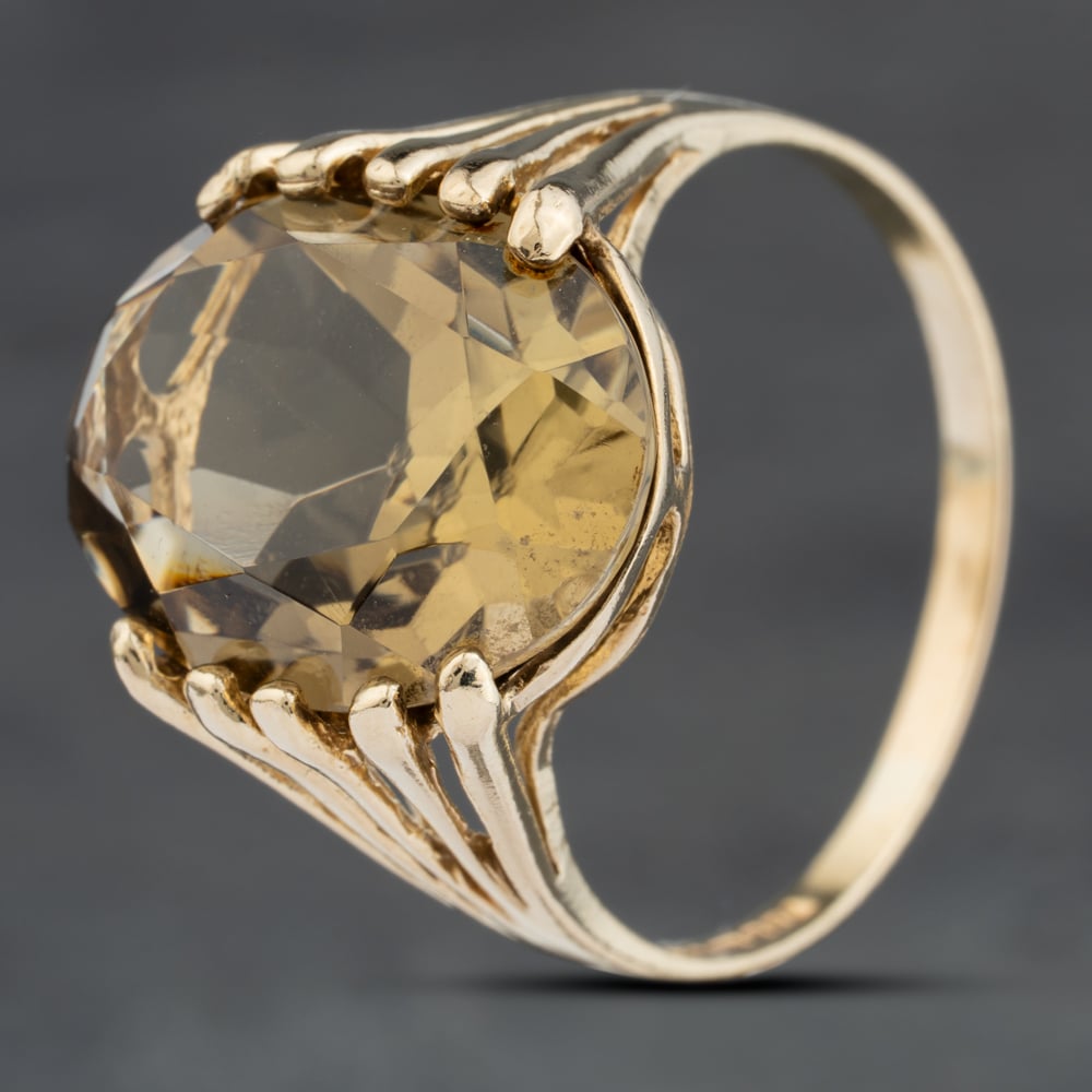 Click to view product details and reviews for Pre Owned 9ct Yellow Gold Smoky Quartz Large Oval Tension Set Dress Ring 41103966.