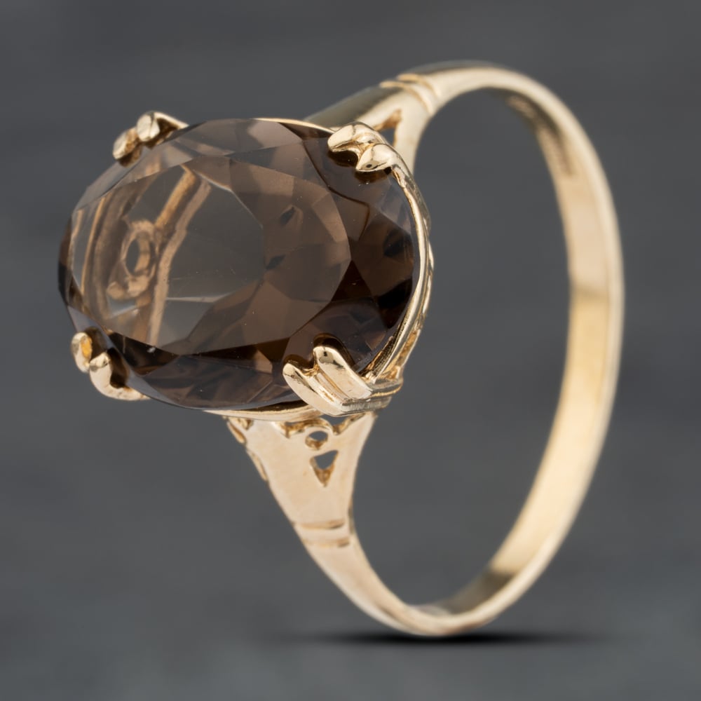Click to view product details and reviews for Pre Owned 9ct Yellow Gold Smoky Quartz Oval Dress Ring 41103988.