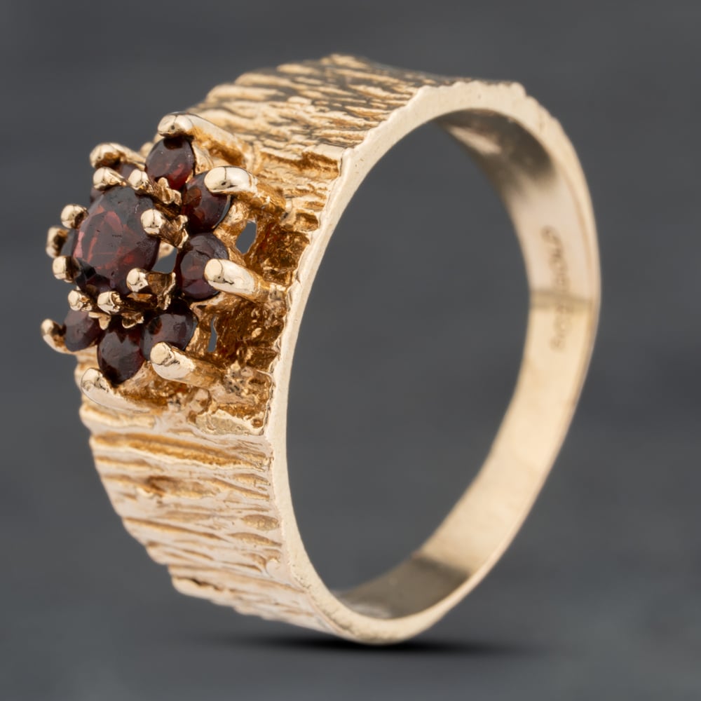 Click to view product details and reviews for Pre Owned Vintage Yellow Gold Garnet Bark Effect Shoulders Cluster Ring 41104034. Click to view product details and reviews for Pre Owned Vintage Yellow Gold Garnet Bark Effect Shoulders Cluster Ring 41104034.