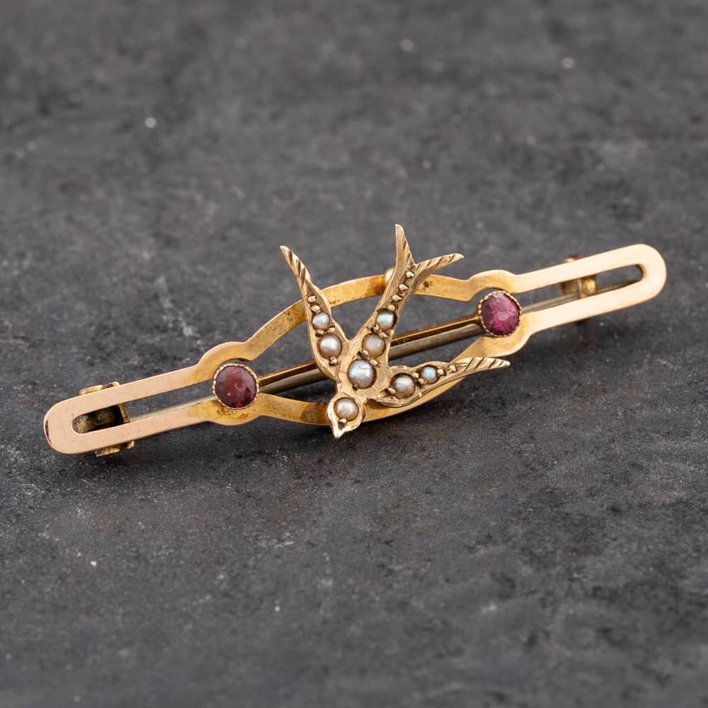 Product photograph of Pre-owned Vintage Rose Gold Ruby Amp Seed Pearl Swallow Brooch 41131079 from The Jewel Hut