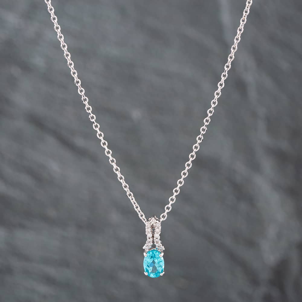 Product photograph of Pre-owned 9ct White Gold Oval Cut Blue Apatite Amp Single Cut Diamond Pendant Amp 18 Inch Trace Chain 41141769 from The Jewel Hut