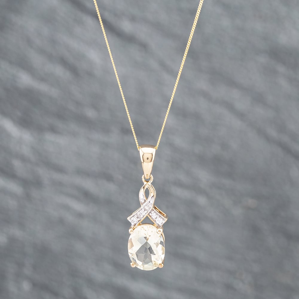 Product photograph of Pre-owned 9ct Yellow Gold White Topaz Amp Scapolite Pendant Amp 18 Inch Curb Chain 41142052 from The Jewel Hut