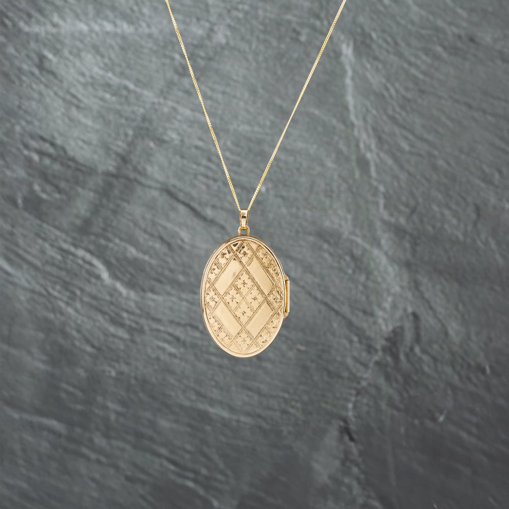 Click to view product details and reviews for Pre Owned 9ct Yellow Gold Oval Patterned Locket Pendant And 18 Inch Curb Chain 41142734.