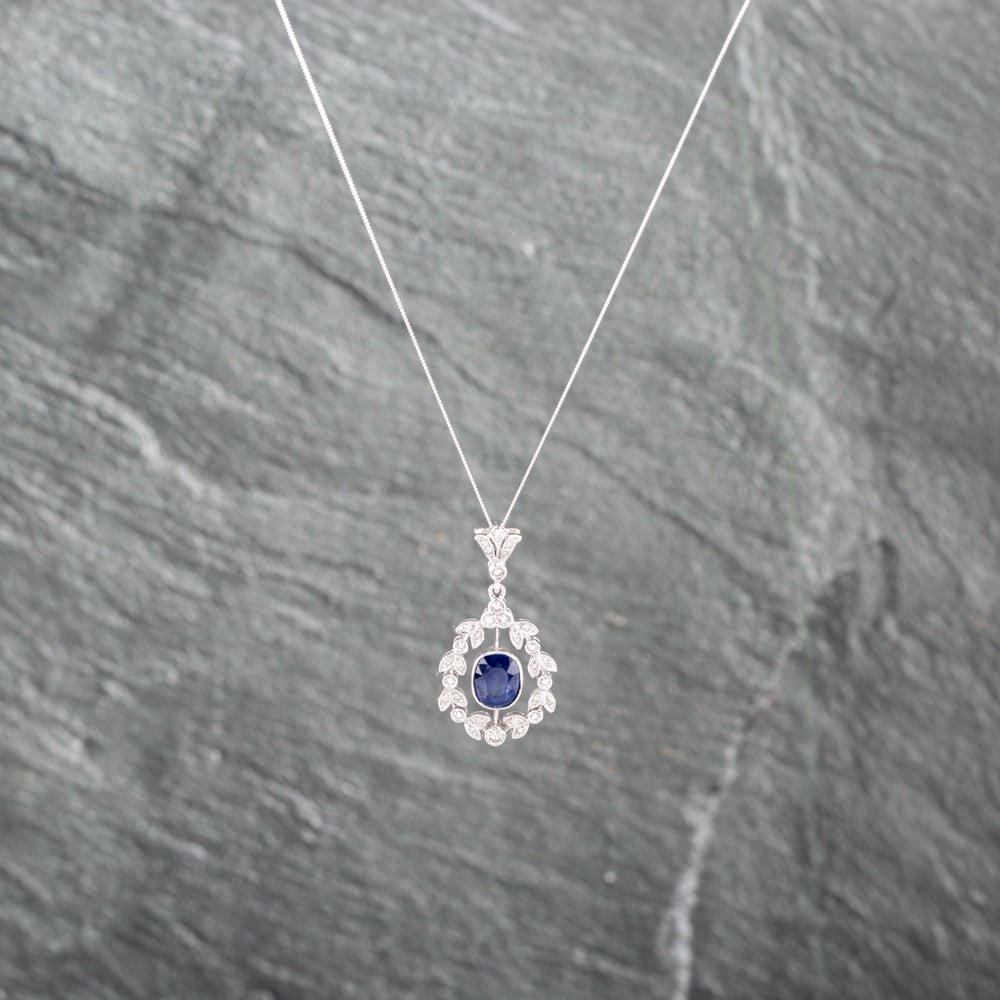Click to view product details and reviews for Pre Owned 18ct White Gold Sapphire And Brilliant Cut Diamond Ornate Gemstone Pendant And 18 Inch Curb Chain 41143079.