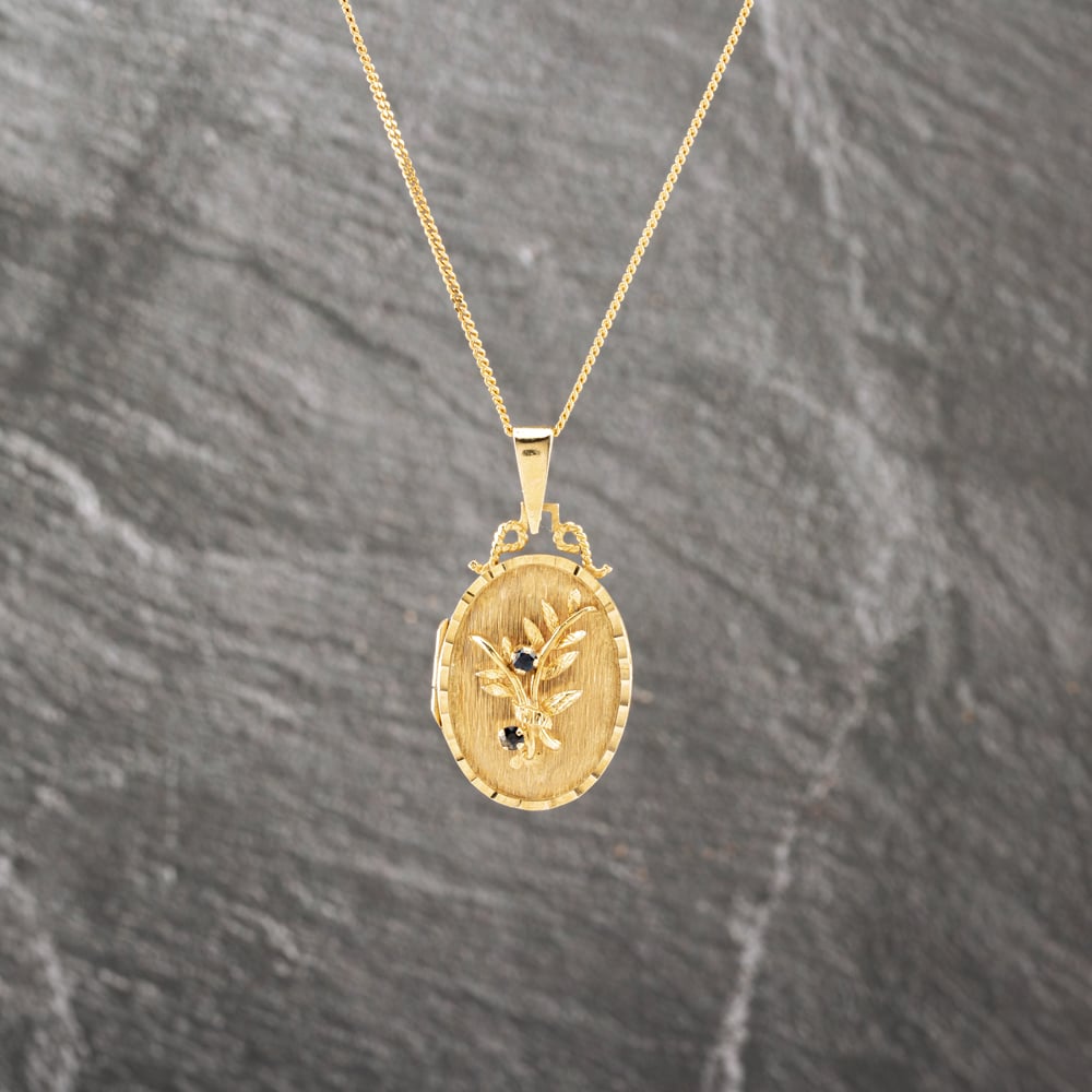 Click to view product details and reviews for Pre Owned 9ct Yellow Gold Sapphire Oval Flower Locket Pendant And 18 Inch Curb Chain 41143093.