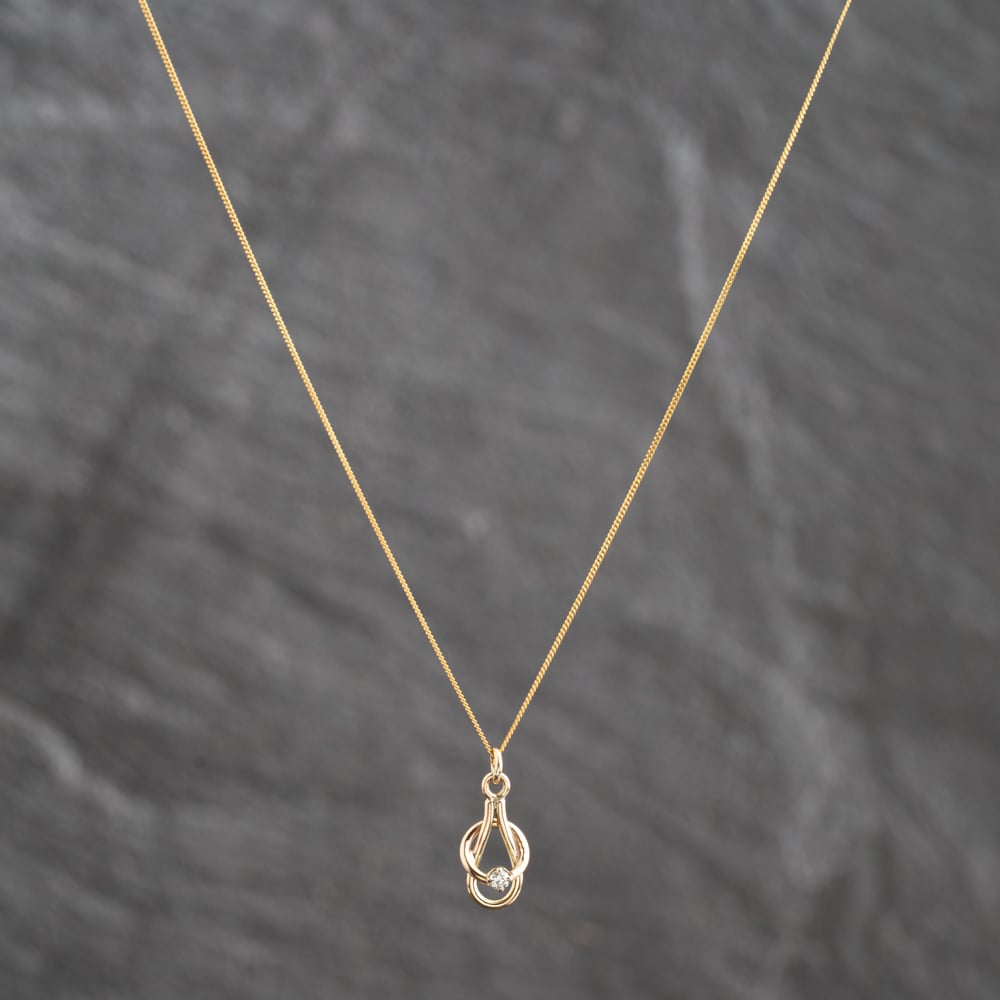 Pre-Owned Yellow Gold Diamond Knot Loop Pendant &amp; 18 Inch Curb Chain 41143695