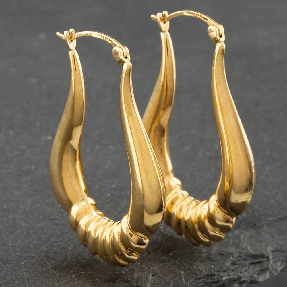 Product photograph of Pre-owned 9ct Yellow Gold Chunky Patterned Oval Creole Earrings 41171243 from The Jewel Hut