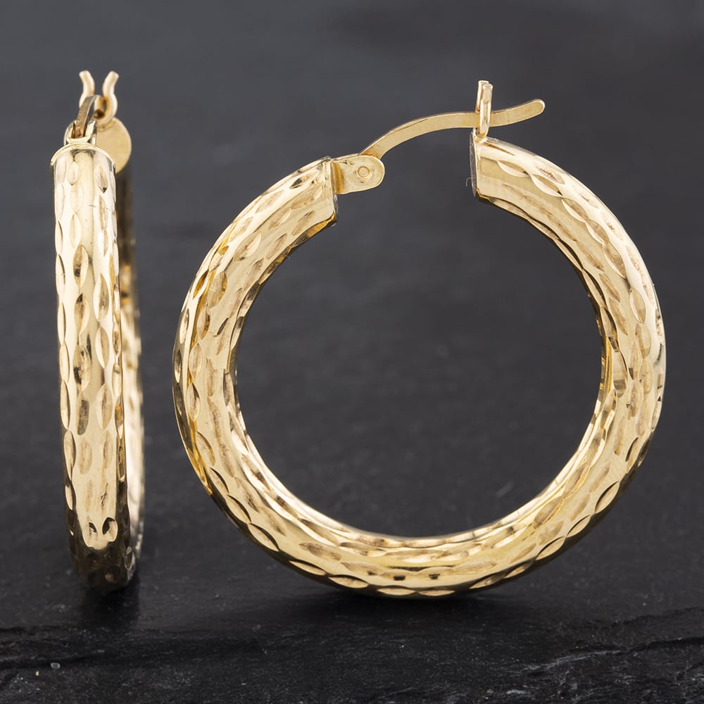 Product photograph of Pre-owned 9ct Yellow Gold 29 5mm Diamond Cut Patterned Hoop Earrings 41172455 from The Jewel Hut