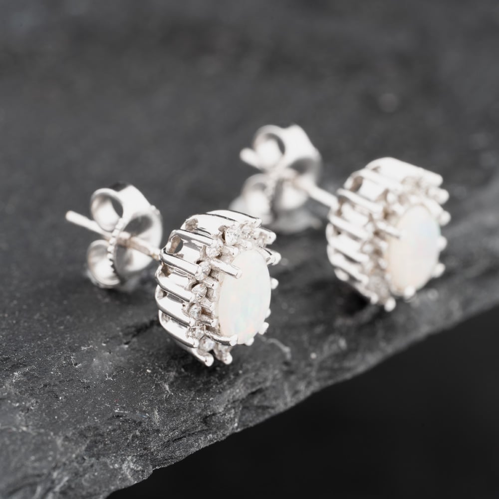 Click to view product details and reviews for Pre Owned 18ct White Gold Opal And Diamond Oval Cluster 85mm Stud Earrings 41172771.