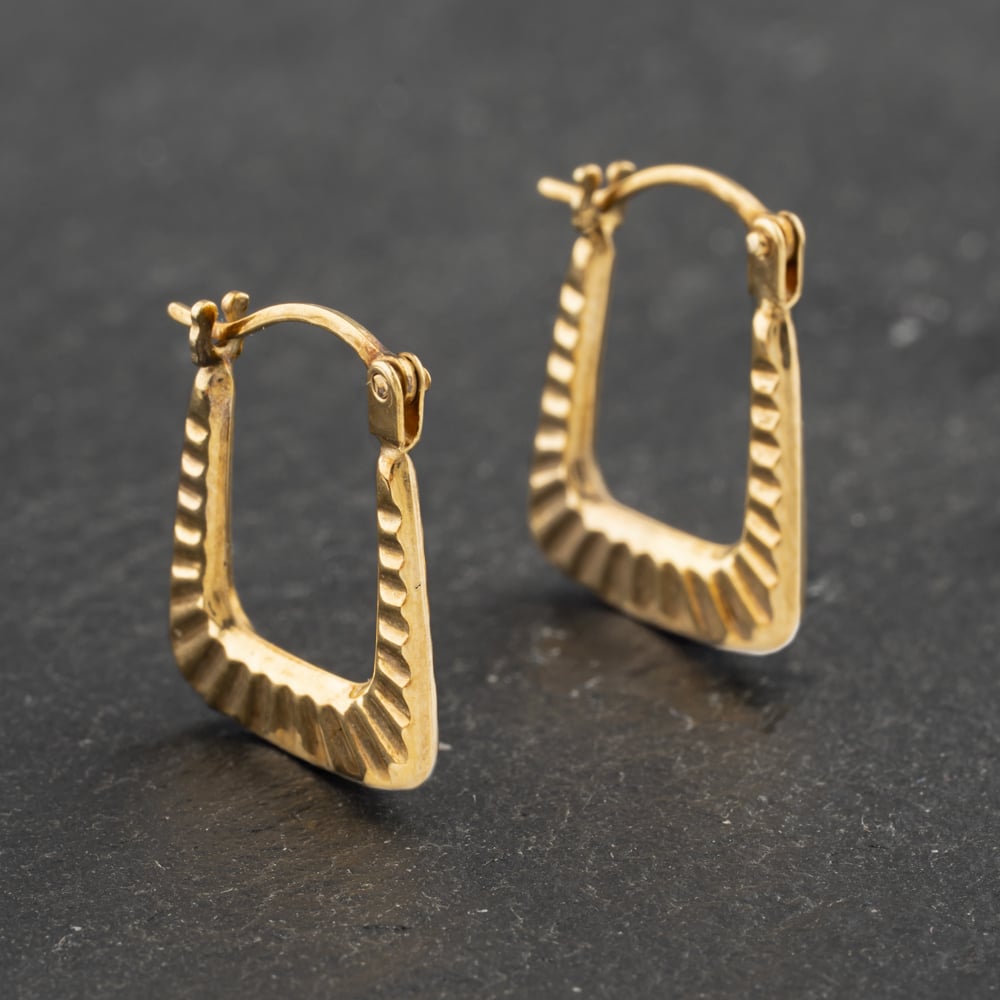 Click to view product details and reviews for Pre Owned Yellow Gold 145mm Lined Pattern Creole Earrings 41173015.