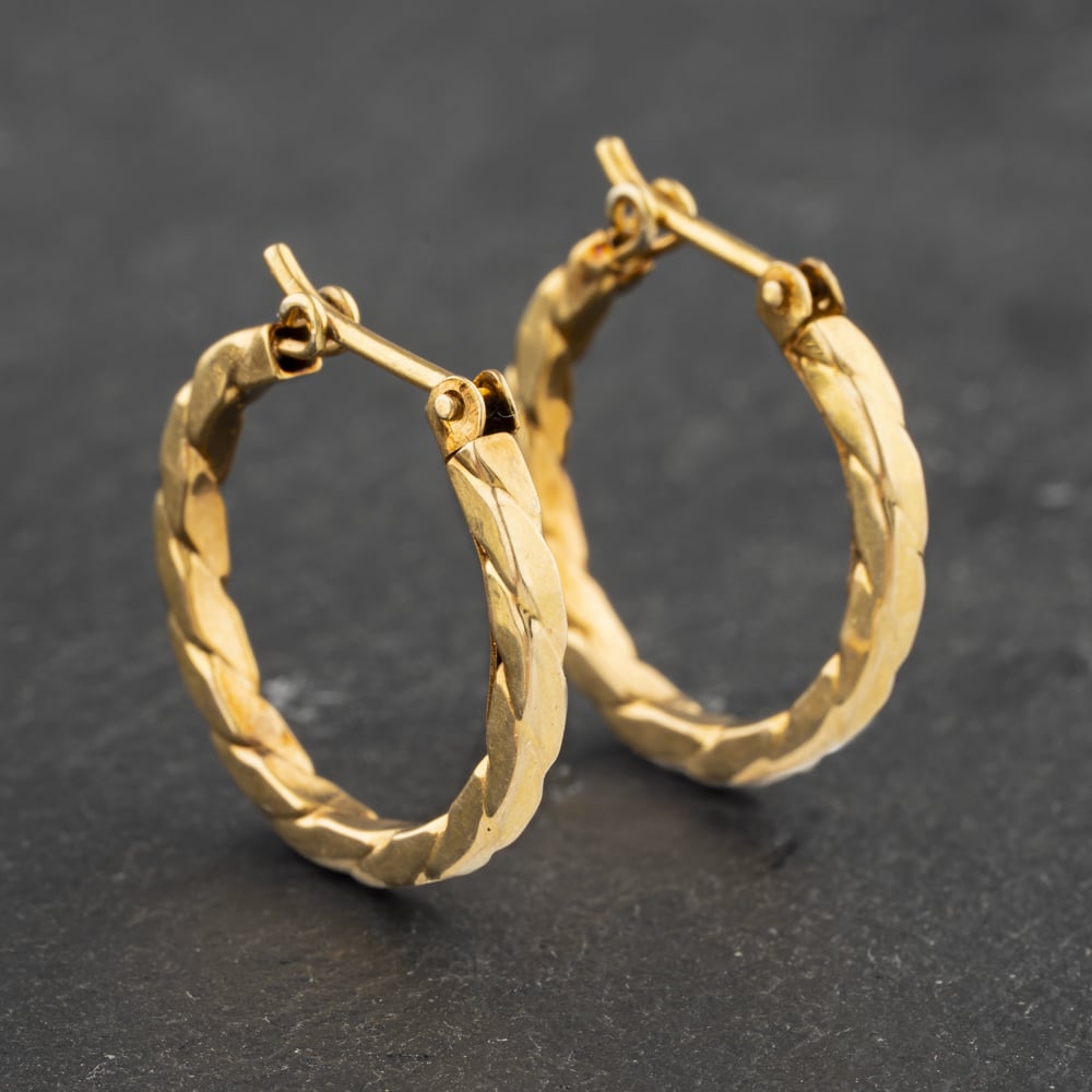 Click to view product details and reviews for Pre Owned Yellow Gold 18mm Twist Hoop Earrings 41173020.