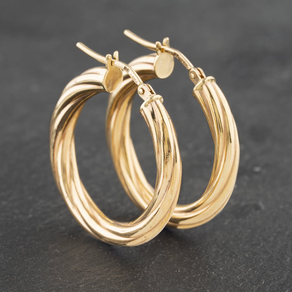 Click to view product details and reviews for Pre Owned Yellow Gold 26mm Twist Hoop Earrings 41173032.