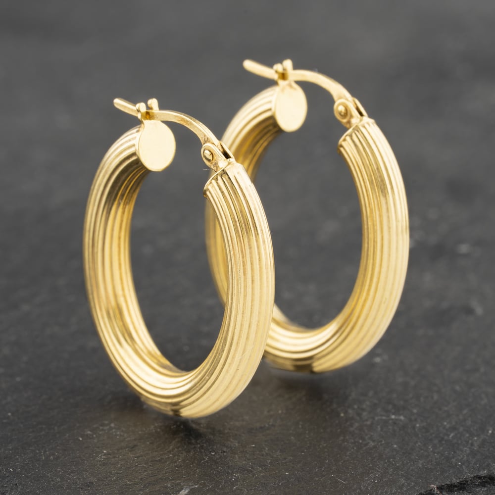 Click to view product details and reviews for Pre Owned 9ct Yellow Gold 265mm Oval Lined Pattern Hoop Earrings 41173115.