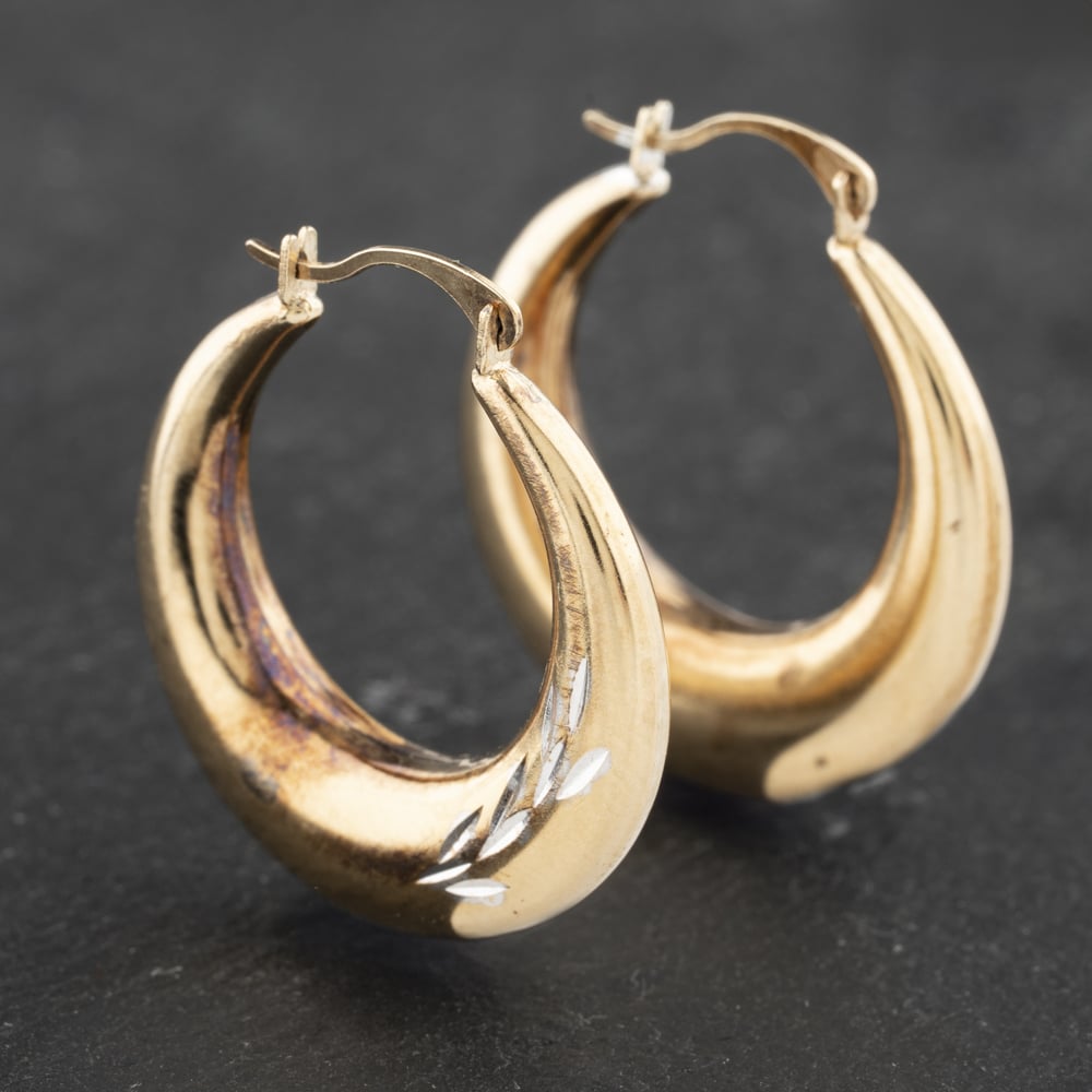 Click to view product details and reviews for Pre Owned Yellow Gold 24mm Diamond Cut Leaf Pattern Hoop Earrings 41173142.