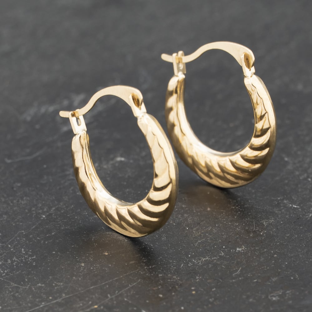 Click to view product details and reviews for Pre Owned Yellow Gold 15mm Small Patterned Creole Earrings 41173202.