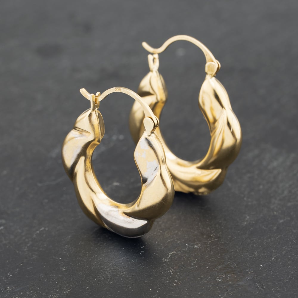 Click to view product details and reviews for Pre Owned Yellow Gold 23mm Embossed Creole Earrings 41173209.
