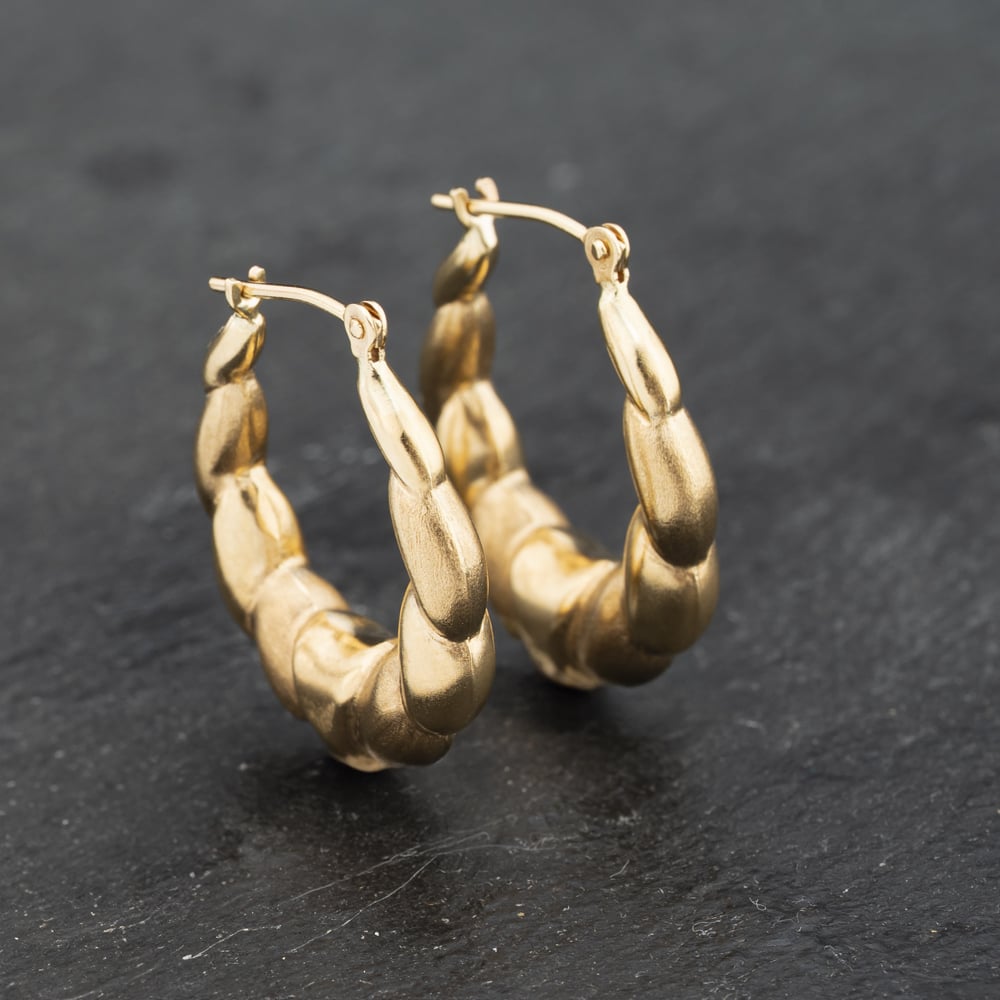 Click to view product details and reviews for Pre Owned Yellow Gold 22mm Embossed Patterned Creole Earrings 41173259.
