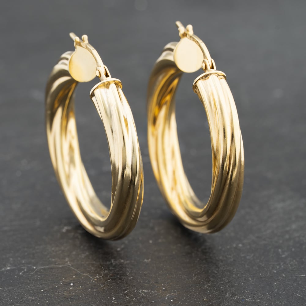 Click to view product details and reviews for Pre Owned 9ct Yellow Gold 30mm Twist Hoop Earrings 41173303.