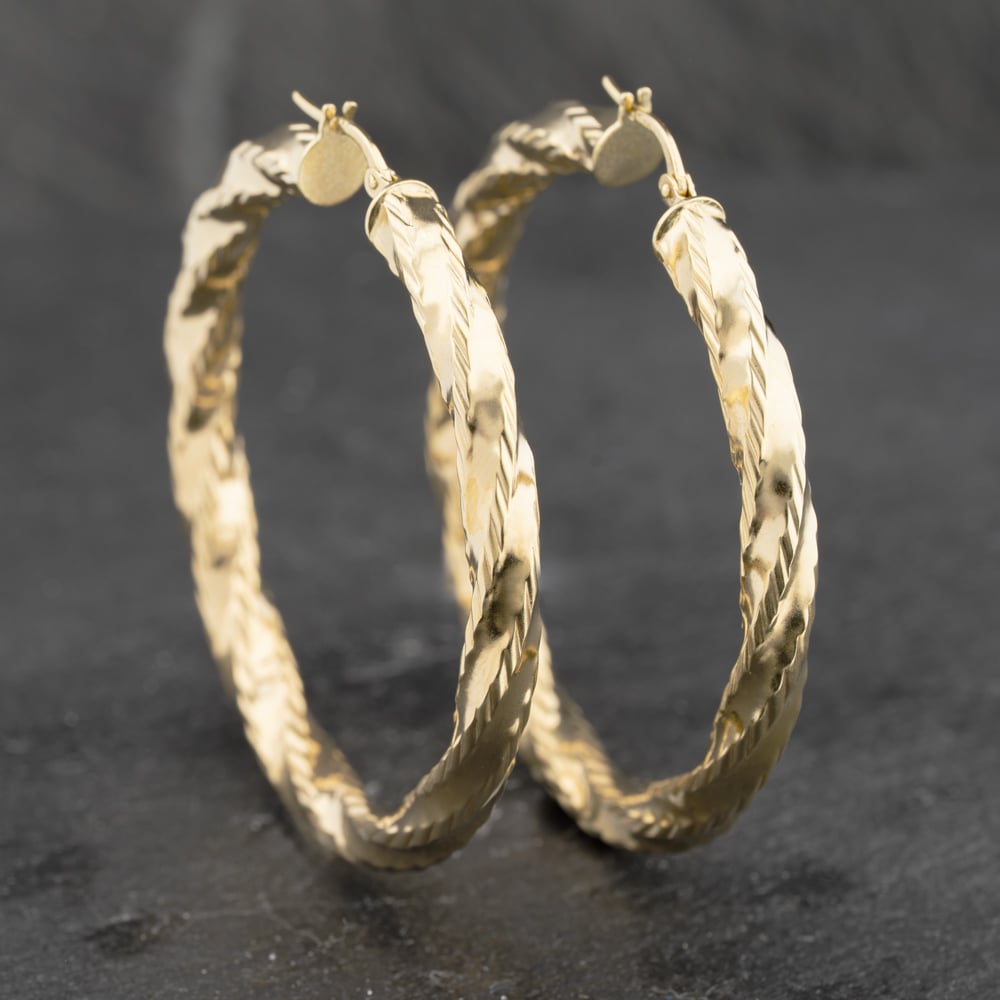 Click to view product details and reviews for Pre Owned 9ct Yellow Gold 48mm Twist Hoop Earrings 41173309.
