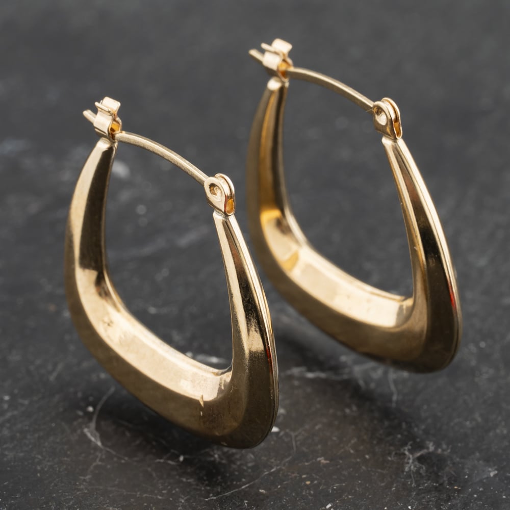 Click to view product details and reviews for Pre Owned Yellow Gold 22mm Oblong Creole Earrings 41173400.