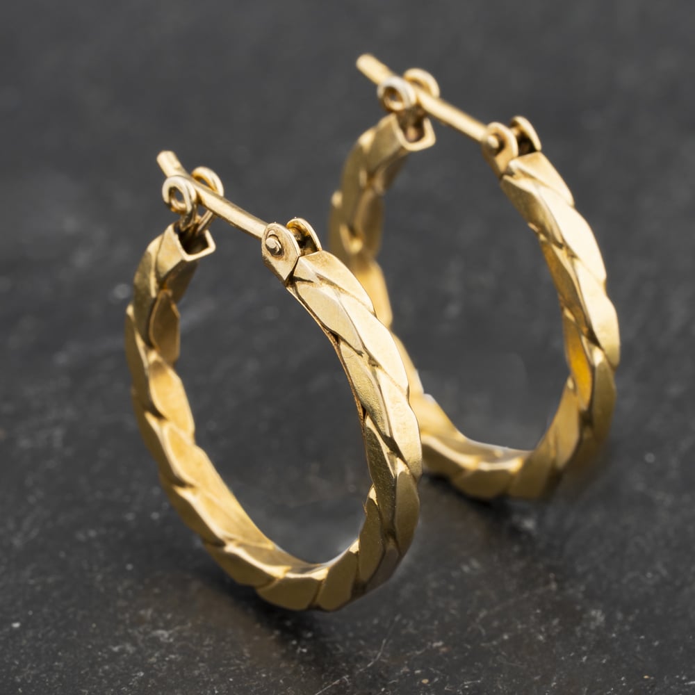 Click to view product details and reviews for Pre Owned Yellow Gold 18mm Twist Cut Hoop Earrings 41173415.