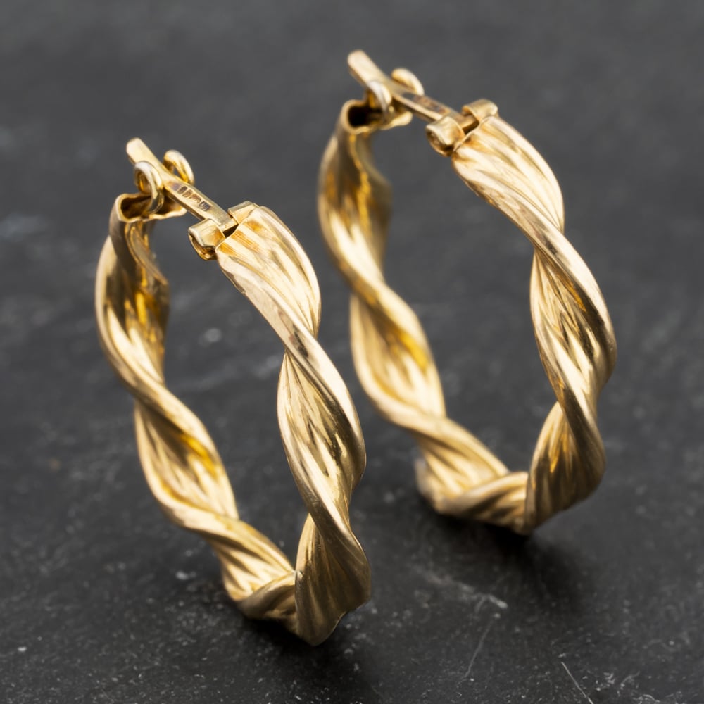 Click to view product details and reviews for Pre Owned Yellow Gold 20mm Twist Hoop Earrings 41173495.