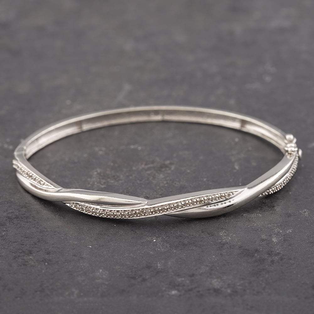 Product photograph of Pre-owned 9ct White Gold 0 50ct Brilliant Cut Diamond Twisted Standard Hinged Bangle 41211203 from The Jewel Hut