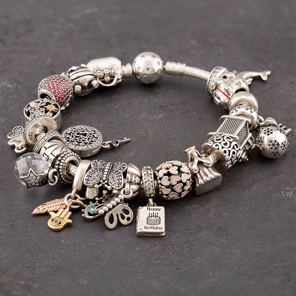 Product photograph of Pre-owned Silver Including 20 Assorted Charms 19cm Charm Bracelet 41221251 from The Jewel Hut